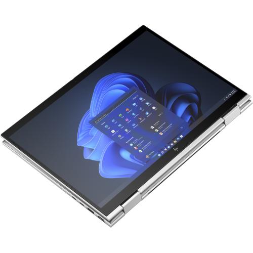 Silver 2 in 1 laptop computer in tablet format with screen switched on.